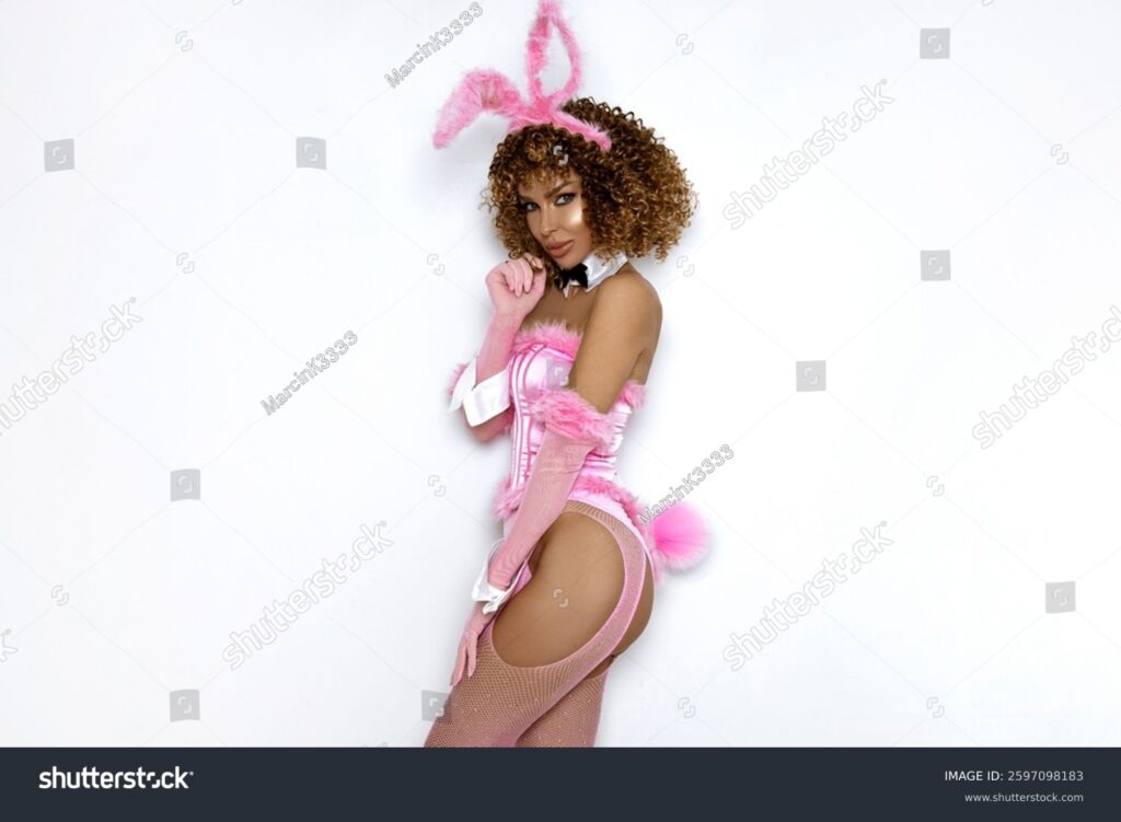 stock photo happy blonde woman in a sexy pink bunny costume poses sensually for easter on white background 2597098183 stock photo happy blonde woman in a sexy pink bunny costume poses sensually for easter on white background 2597098183